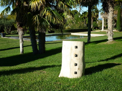 Floated wood stool studded with faceted nails