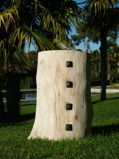 Floated wood stool studded with faceted nails